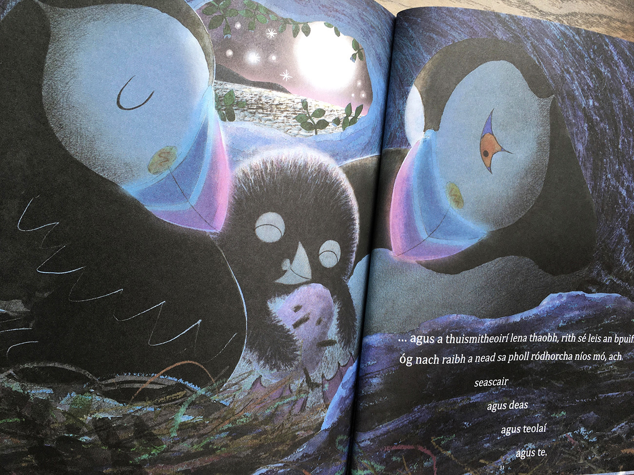 It's Too Dark Puffling scene where the little puffling finally snuggles with his parents inside the warm burrow